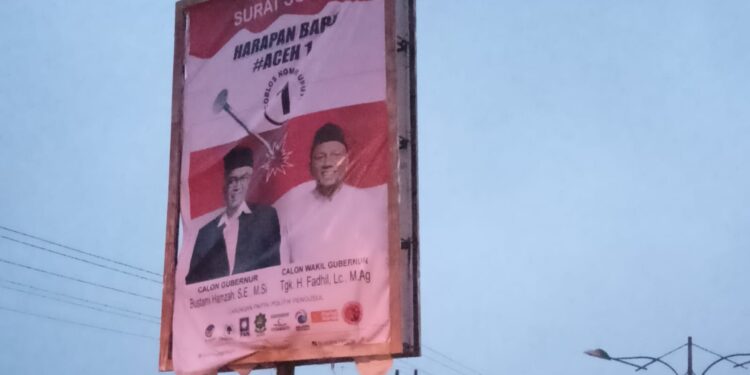 Pemuda Pancasila Aceh Singkil Turun Tangan Pasang Baliho Cagub Om Bus